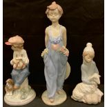 A Lladro figure, Pocketful of Wishes, designed by Antonio Ramos, number 7650, 29cm; others, My