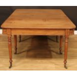 A 19th century mahogany rounded rectangular dining table, one additional leaf, turned legs, Lewty’
