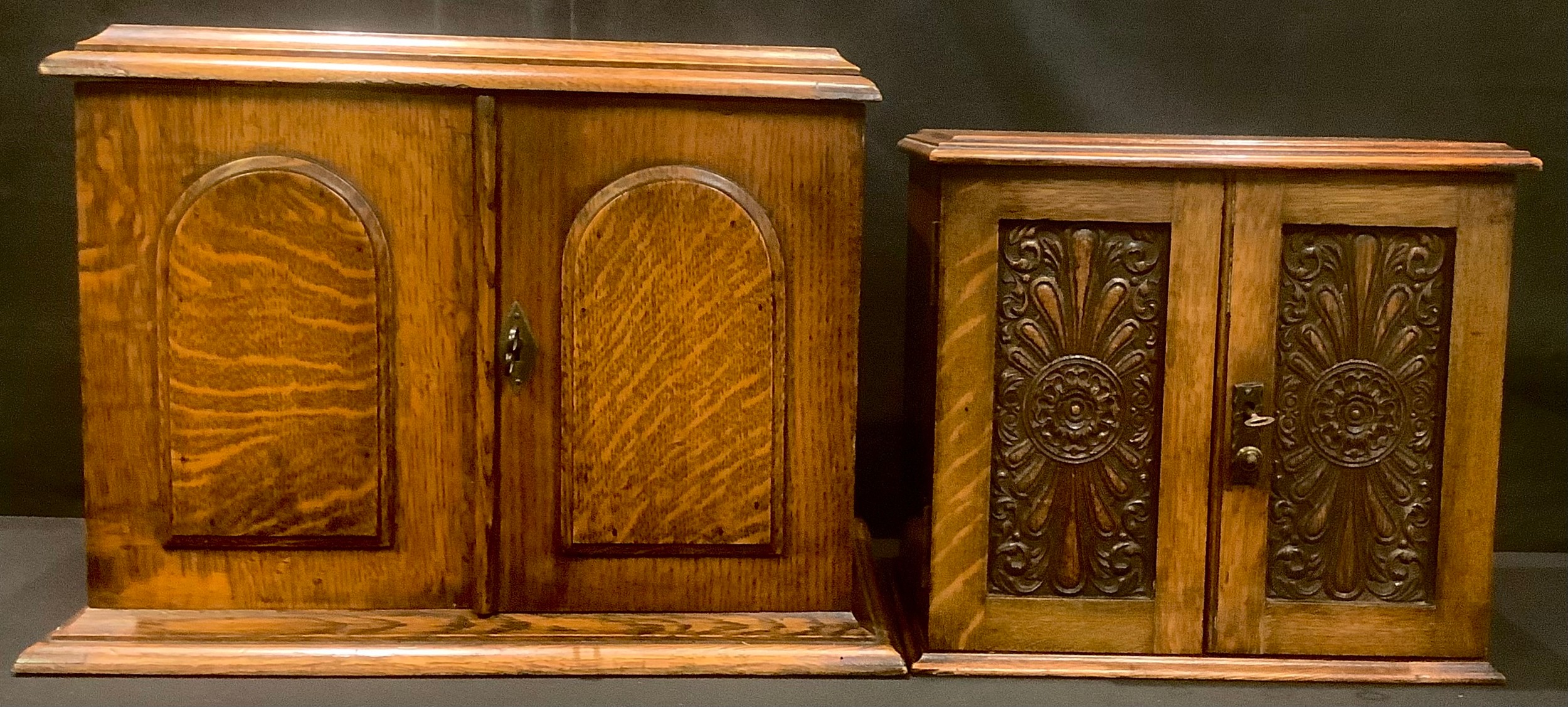 A Victorian oak after dinner cabinet, fitted for smoking and drinking with a tobacco jar, pipe rack,