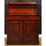 An early Victorian mahogany chiffonier, rectangular superstructure with shallow shelf above a long