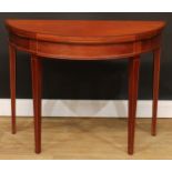 A George III style mahogany demilune tea table, hinged top, tapered legs, 72.5cm high, 97.5cm