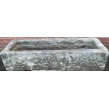 A 19th century Derbyshire gritstone trough, 32cm high, 140cm wide, 46cm wide **Please note that some
