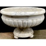 An Italian marble half fluted pedestal oval garden urn, oval base, ball feet, 64cm high, 74cm