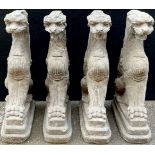 A set of four composition architectural caryatids, each modelled as a griffin, 49cm high **Please