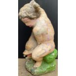 A composite garden fountain, now painted, as a putti holding a carp, 62cm high **Please note that