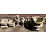 A pair of square stone 'brick' planters, on stands, 23cm wide, 26cm high; a garden stature,