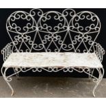 An early 20th century three seat wire work garden bench, scroll back and legs, solid seat, 113cm