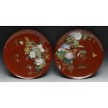 A pair of Minton's Aesthetic Movement chargers, painted in polychrome with flowers and butterflies