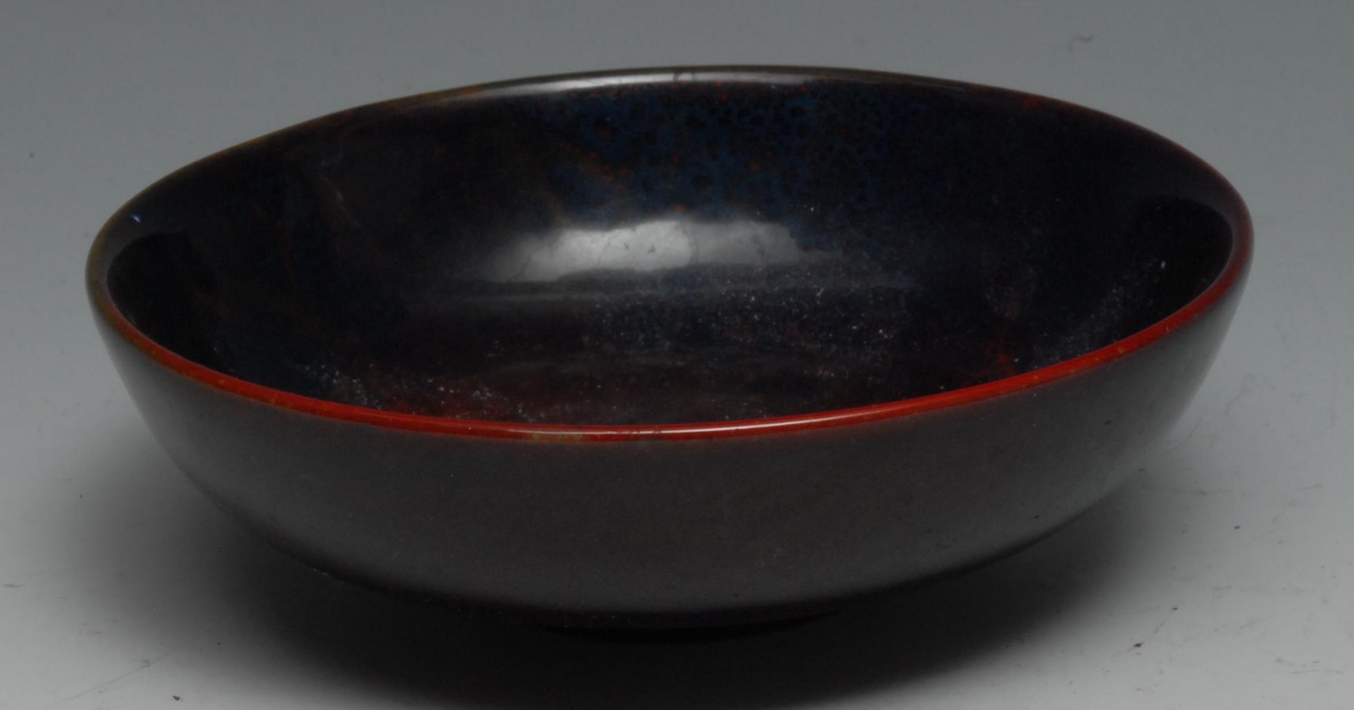 A Royal Doulton Sung flambe circular bowl, typically glazed in mottled tones, 13cm diam, printed