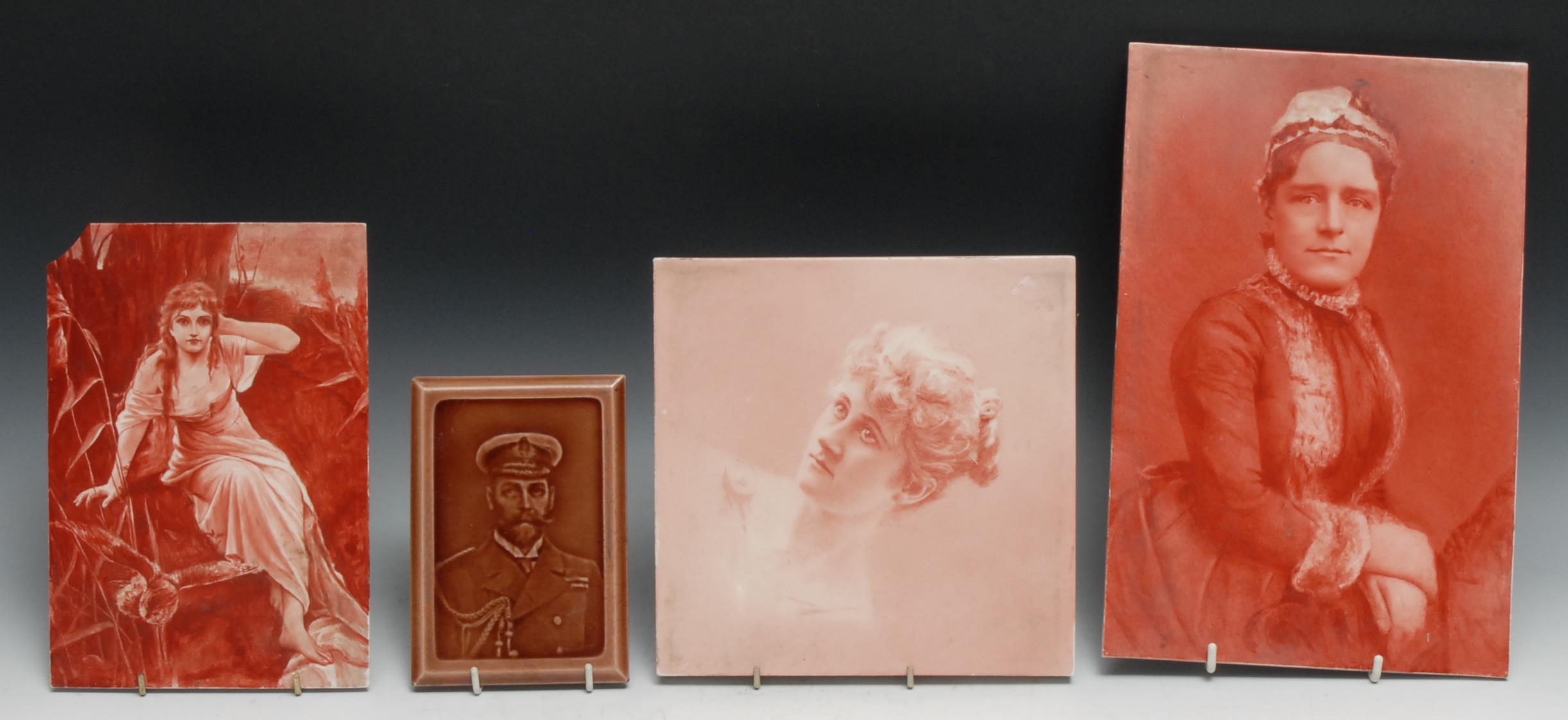 A Minton, Hollins & Co tile, decorated with a red sepia photographic portrait of a young girl, 20.