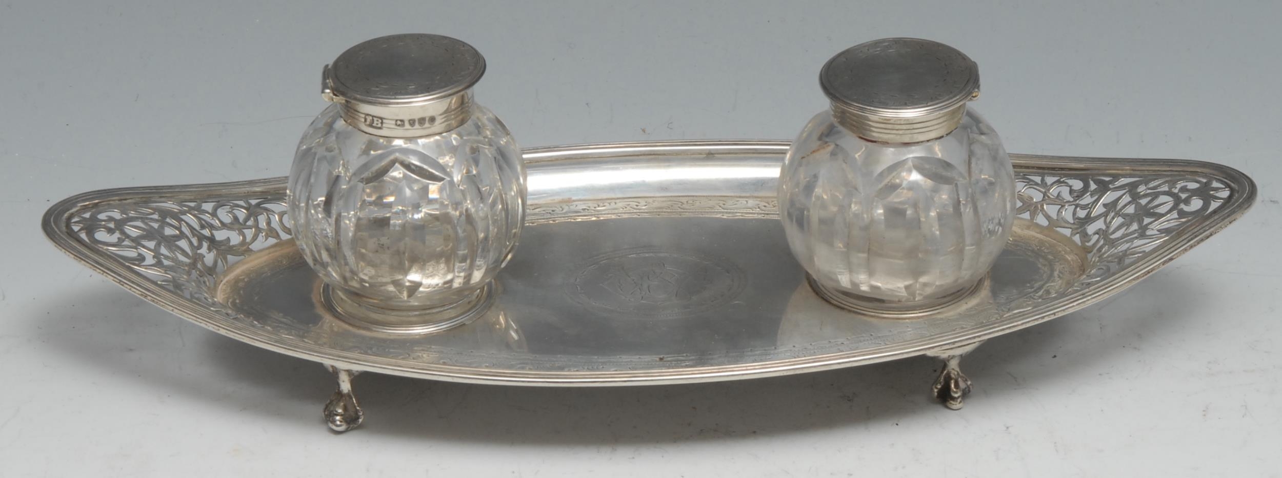 A George III silver navette shaped inkstand, pierced and bright-cut engraved in the Neo-Classical