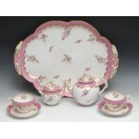 A Coalport cabaret set on tray, comprising lobed oval tray, globular teapot and cover, two cups