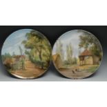 A pair of T C Brown Westhead Moore & Co Aesthetic Movement chargers, painted by Julia Gauci, signed,