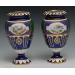 A pair of Royal Crown Derby pedestal ovoid vases, painted by George Darlington, with fanciful birds,