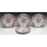 A set of four Chinese Famille Rose shaped circular dishes, decorated with flower sprays and