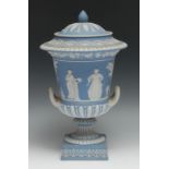 A 19th century Wedgwood Jasperware two handled pedestal campana shaped vase and cover, typically