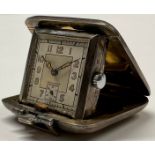 An Art Deco silver purse watch, engine turned, 4cm wide, Birmingham 1938