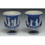 A pair of early 20th century Wedgwood Jasperware two handled campana shaped vases, typically