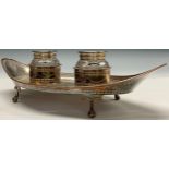 A large George III Old Sheffield Plate boat shaped standish, cylindrical clear glass wells, the