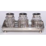 A George III Provincial silver rectangular partners' three-bottle inkstand, 21cm wide, William