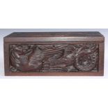 A large 19th century oak writing box, incorporating earlier panels, hinged cover inlaid in holly and