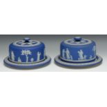 A near pair of 20th century Wedgwood Jasperware cheese domes and stands, typically sprigged with