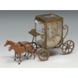 A French gilt metal novelty vitrine pocket watch stand, as a state coach, bevelled glass panels,