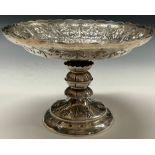 A Victorian silver shaped circular pedestal table centre fruit comport, chased with flowers,