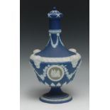 A 19th century Wedgwood Jasperware urnular vase and cover, sprigged with swags and rams masks on