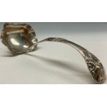 A Dutch silver ladle, chased with flowers, stiff leaves and scrolls, 31cm long, 164g