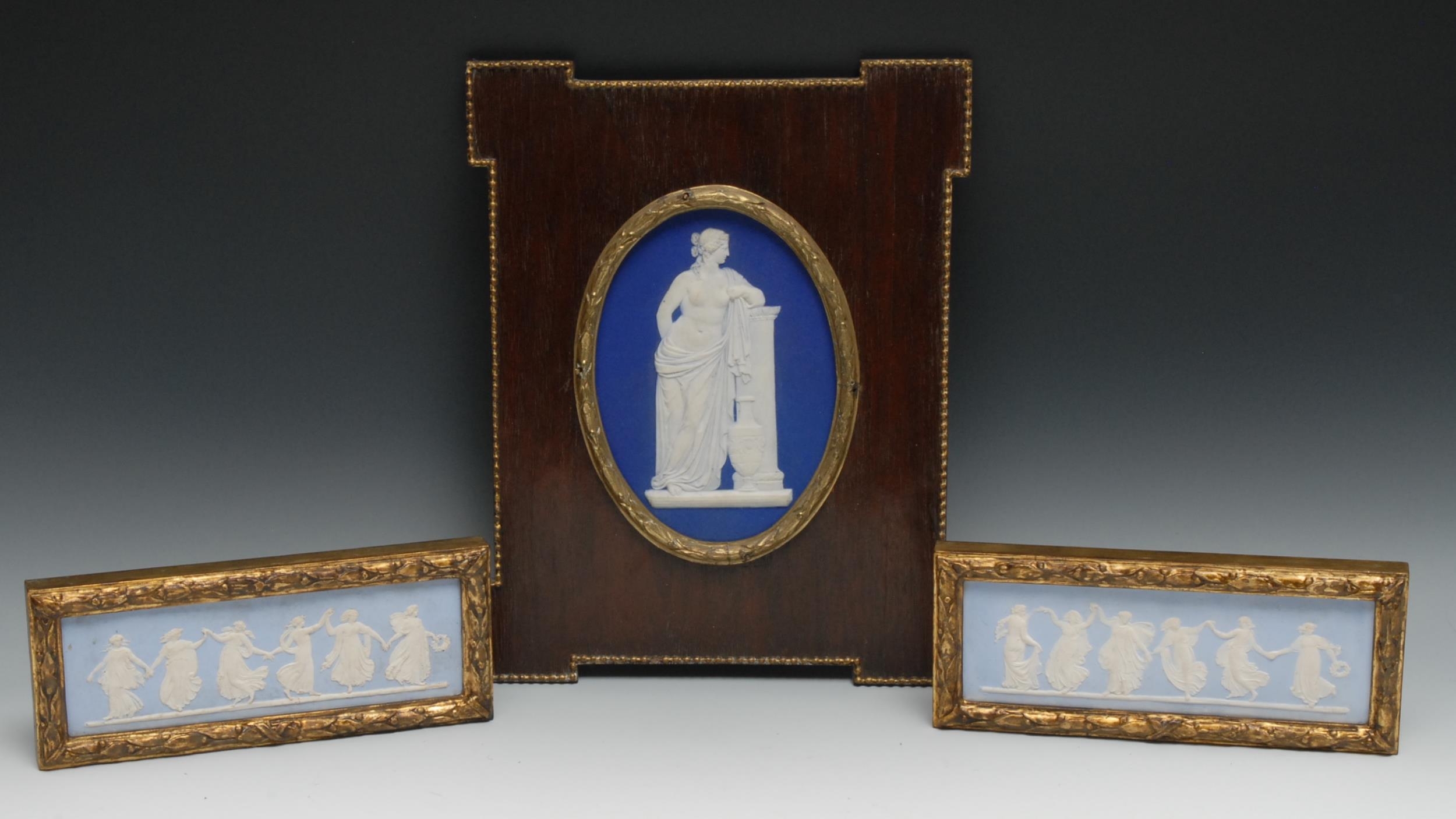 A pair of 19th century Wedgwood Jasperware rectangular plaques, typically sprigged in white with