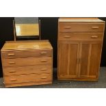 A golden oak tallboy, two long drawers over two doors, 123cm high, 83cm wide, 48cm deep; dressing