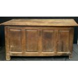 A large 18th century oak blanket box, c.1750 four plank top, the front with four fielded panels,