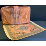 A G Novi leather holdall case, 71cm wide, 49cm high; a Persian Seiden Ghim silk prayer mat, 81cm x