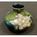 A Moorcroft pottery Columbine pattern compressed ovoid vase, impressed marks, 7cm high