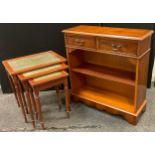 A reproduction walnut bookcase, fitted with two cockbeaded drawers, 79cm high, 76cm wide; a nest