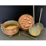 A late 19th century copper flan dish jelly mould, 28.5cm diameter; hand hammered dipper ladles etc