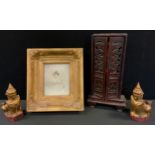 A Chinese family shrine cabinet, pierced doors, scroll feet, the boards for the relatives of Sz-To-