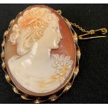 A 20th century shell cameo, carved with a Young Lady in profile, 9ct gold mount, 54mm x 42mm, 16.1g