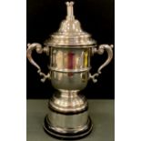 A silver two handled trophy cup and cover, central girdle, castle finial, 32cm high, Birmingham