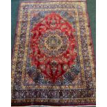 A Persian Meshed rug / carpet, large circular medallion to centre, within a field woven with