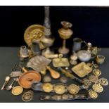 A novelty brass table bell; 19th century oils lamps; pewter ale mugs; crumb scoop, horse brasses etc