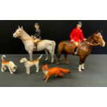 A Beswick model, Huntswoman, no 1730, grey; Huntman, no 1501, brown; two hounds and Fox, printed