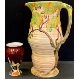 A Carlton Ware Oak Tree ribbed jug, in relief, 36cm high, printed mark; a Carlton Ware pedestal