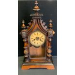 A German walnut mantel clock, twin winding holes, 54cm high, c.1890