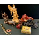 A Chinese hardwood bull; resin dragon; carved figures; etc