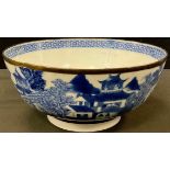 A Chinese blue and white bowl, decorated with Willow pattern, the interior with cell border, 23cm