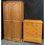 A contemporary pine two-door wardrobe, 178cm tall x 91cm wide; and a conforming chest of drawers,