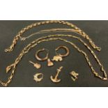 A 9ct gold chain, 5.8g; a 9ct gold electric guitar charm, 0.5g; a 9ct gold anchor, 1.6g; gold