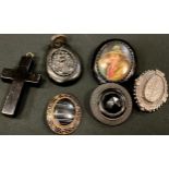 A Victorian black jet pendant; a cross; other brooches; a hardstone brooch; a Victorian silver